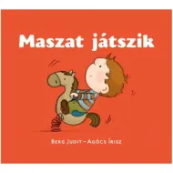 Maszat bawi się książką z bajkami